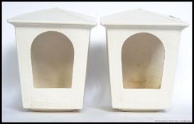 A matching pair of wall pockets / light fixtures, shaped like lanterns stamped to rear SylvaC.