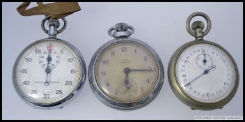 A Smiths Empire pocket watch together with an Excelsior park stopwatch and another.