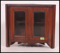 A Victorian small hanging wall cabinet of mahogany construction.