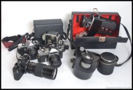 A collection of assorted vintage cameras and accessories to include cine camera,