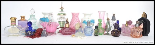 A collection of vintage perfume bottles / atomisers to include coloured glass etc
