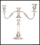 A mid century silver plated candelabra, three branch, of natural form. Complete.