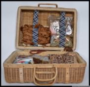 A vintage whisker case containing various items#ms relater to sewing,