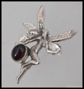 A silver 925 art nouveau style fairy brooch set with a cabochon garnet 6.