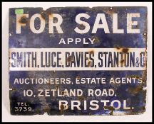 A good early 20th century enamel industrial advertising sign for Auctioneers & Estate Agents Smith,
