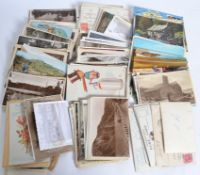 A collection of postcards dating fromn the early 20th century to include vistas,
