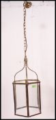 A contemporary but vintage style brass and glass hanging ceiling lamp
