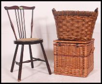 An early 20th century spinning chair along with a vintage whicker hamper and a whisker log basket.