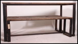 A contemporary Industrial style wooden and cast metal refectory dining table together with 2