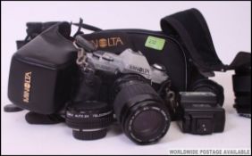 A collection of cameras etc to include a Minolta SLR X-300 camera with lenses together with