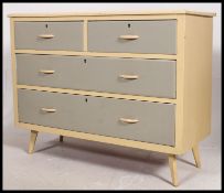 A retro 1950's painted shabby chic two tone chest of drawers raised on angled feet 84x106x46cm