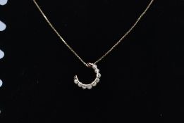 A 9ct gold pearl and diamond set pendant and necklace chain.
