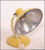 A vintage retro original ' Radiaray ' heat lamp - aluminium construction, in yellow.