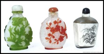 A collection of oriental Chinese snuff / scent bottles - 2x glass, 1x being carved bone.