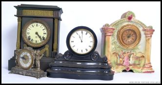 A collection of four late 19th and 20th century clocks to include slate examples,