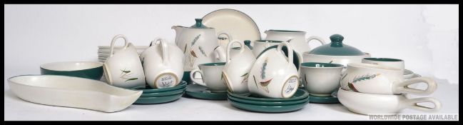 A good quantity of Denby ' Wheatsheaf Pattern ' dinner service to include cup, saucers, side plates,