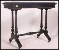 A Victorian JAS Shoolbred Aesthetic movement ebonised and parcel gilt games / card table.