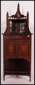 An Edwardian rosewood and marquetry inlaid corner cabinet.
