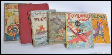 A collection of vintage childrens annuals to include Rupert,