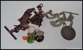 A silver plated albert pocket watch chain with a retro faux tortoiseshell albert chain with silver