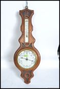 A 1920's oak aneroid banjo barometer.