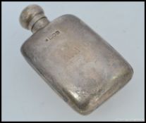 A Victoria silver hallmarked hip flask bearing London hallmarks for 1898 BY W & G Neal.