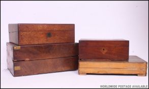 A Victorian walnut writing slope box together with another ( both af ) also with another mahogany