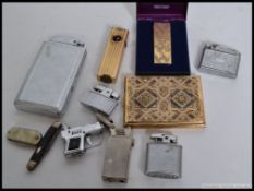A collection of vintage cigarette lighters to include both petrol and gas to include ronson and