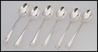 A set of 6 silver hallmarked spoons having reeded border stems.