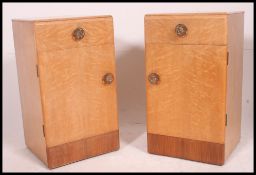 A 1930's Art Deco pair of bedside cabinets in birds eye maple. Single drawers over cupboards.