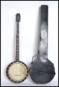 A vintage cased Banjo. Mahogany back with skin having long ebonised neck and head.