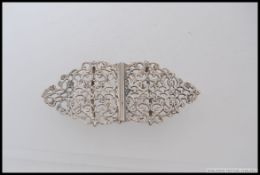 An Edwardian silver hallmarked nurses buckle, Birmingham 1922, fret swag design,