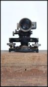 A vintage mid century theodolite being cased by Hilger & Watts Lts London No 70622 mounted on