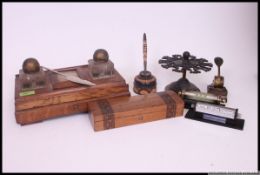 A good Victorian oak desk tidy having twin glass inkwells with pen tray recess.