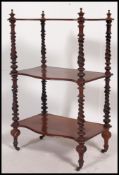 A Victorian walnut barleytwist 3 tier whatnot etagere.