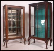 A Queen Anne's china display cabinet in mahogany with glass shelves.