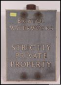 An Industrial Mid century  vintage Bristol Water cast metal Industrial advertising sign with pole