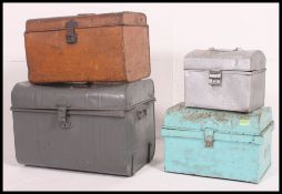 A pair of early 20th century small tin trunks together with a lather attache case and suitcase