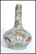 A 19th century Chinese famille rose celedon ground vase decorated with  birds of paradise,