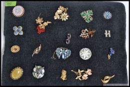 A good collection of 20 vintage costume jewellery dress broaches to include flower broaches ,