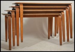 A stack of vintage 20th century stacking school desks.