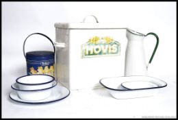 A vintage mid century advertising white enamel bread bin for Hovis along with other enamel items