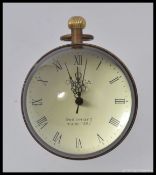 A brass ball desk clock.