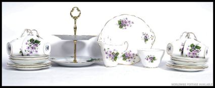 A Regency chintz pattern part tea service comprising cups, saucers, plates etc.