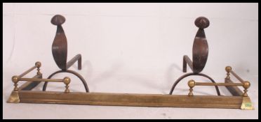 A pair of large 19th century brass fire curbs and one Georgian pair of large fire dogs Fire curbs L