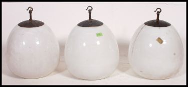 A stunning set of 3 mid century Industrial bulbous white opalescent
glass ceiling lights with