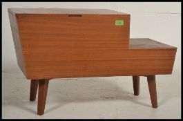 A retro 1950's Vanson teak wood Danish influence angular sewing box raised on tapered legs with