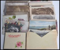 A collection of postcards dating from the early 20th century to include WWI related, silks,