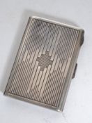 A silver ( tests ) continental cigarette case of rectangular form with unusual design with push