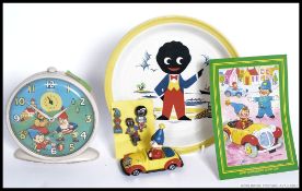 A collection of Enid Blyton's Noddy items to include a Smiths Noddy alarm clock, Noddy car,
